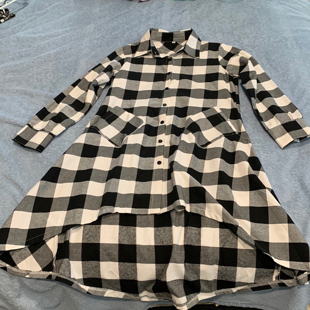 Long in the back short in the front flannel dress. Needs leggings under it.